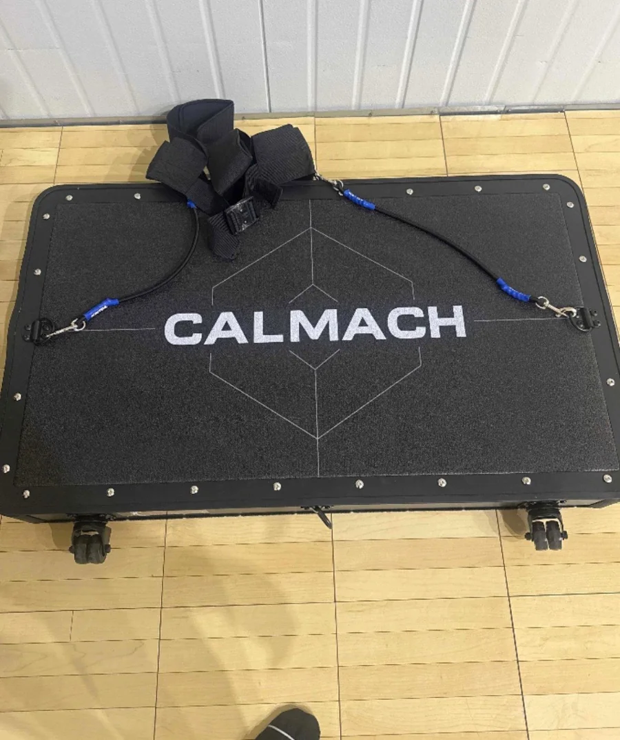 Calmach platform with blue resistance bands set up on a gym floor